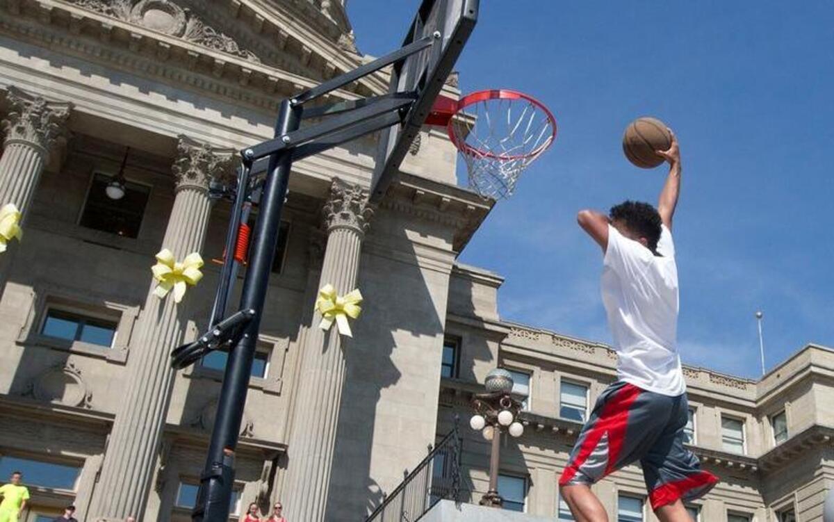 Derrick White, 18, of Boise blind dunks after a 360-degree spin in the early rounds of the BAM Jam Slam Dunk Championship on the steps of the Capitol Building last year.
