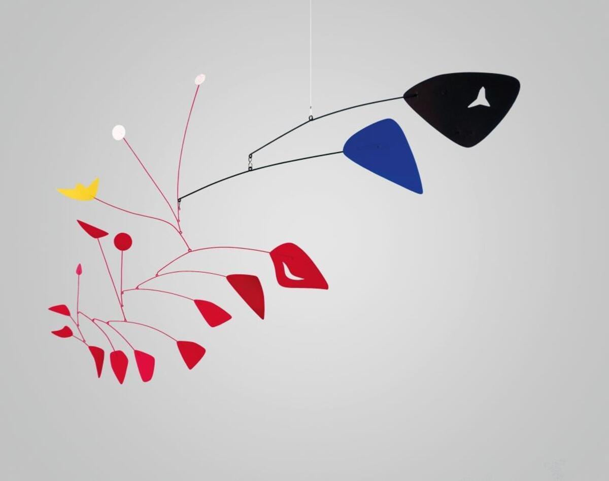 “The Red Ear” (1967) by Alexander Calder (50 inches x 73 inches x 3 inches). The mobile was constructed out of painted sheet metal and wire and hangs on the ceiling for the Boise Art Museum’s exhibit.
