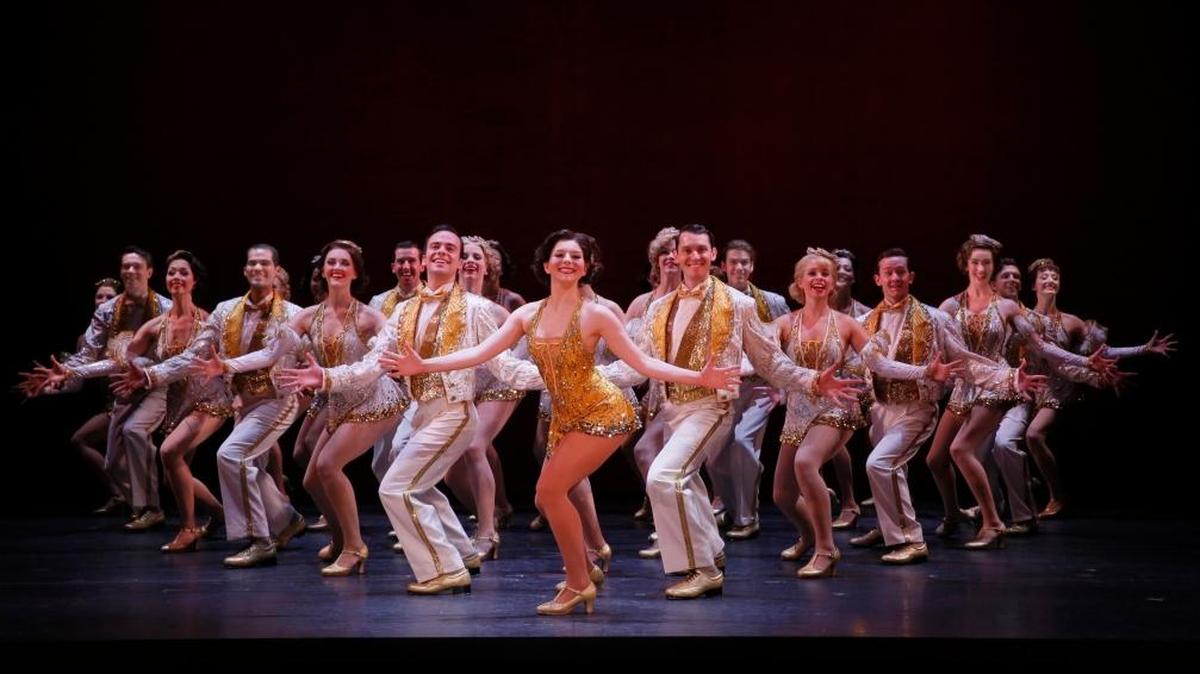 Caitlin Ehlinger as Peggy Sawyer, center, leads the company of “42nd Street”
