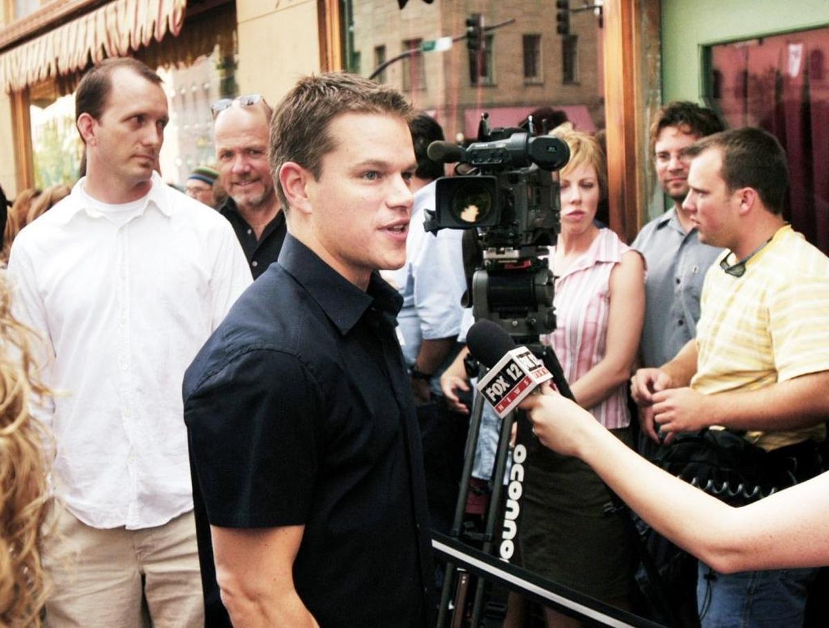 BCT's Matt Clark (in white) watches as Bourne Supremacy star Matt Damon handles press. (2004)