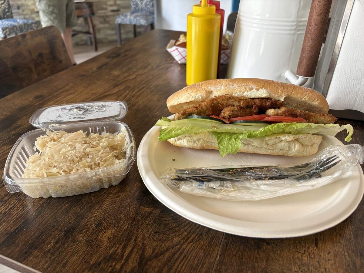 The traditional schnitzel sandwich ($16) comes with a side: sauerkraut, pictured, or potato salad, cucumber salad, chips or cookies.