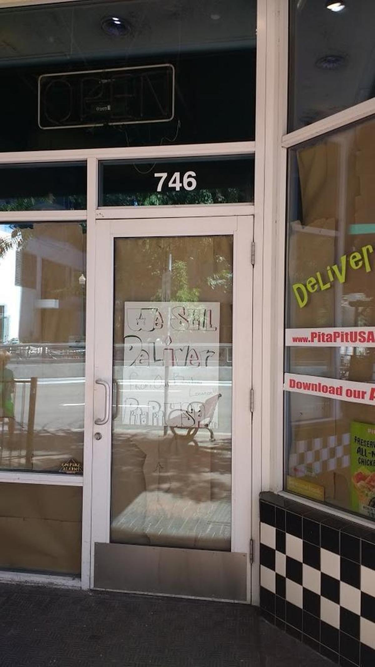 The windows at Pita Pit have been covered while the space is converted into a new restaurant.