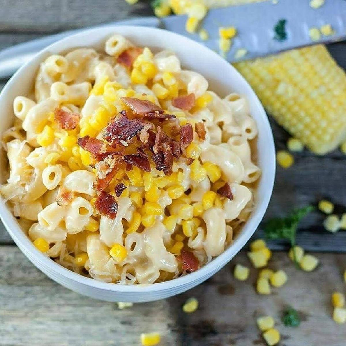 A bowl of Southern Comfort is filled with Mad Mac’s classic macaroni and cheese topped with corn and crispy bacon.