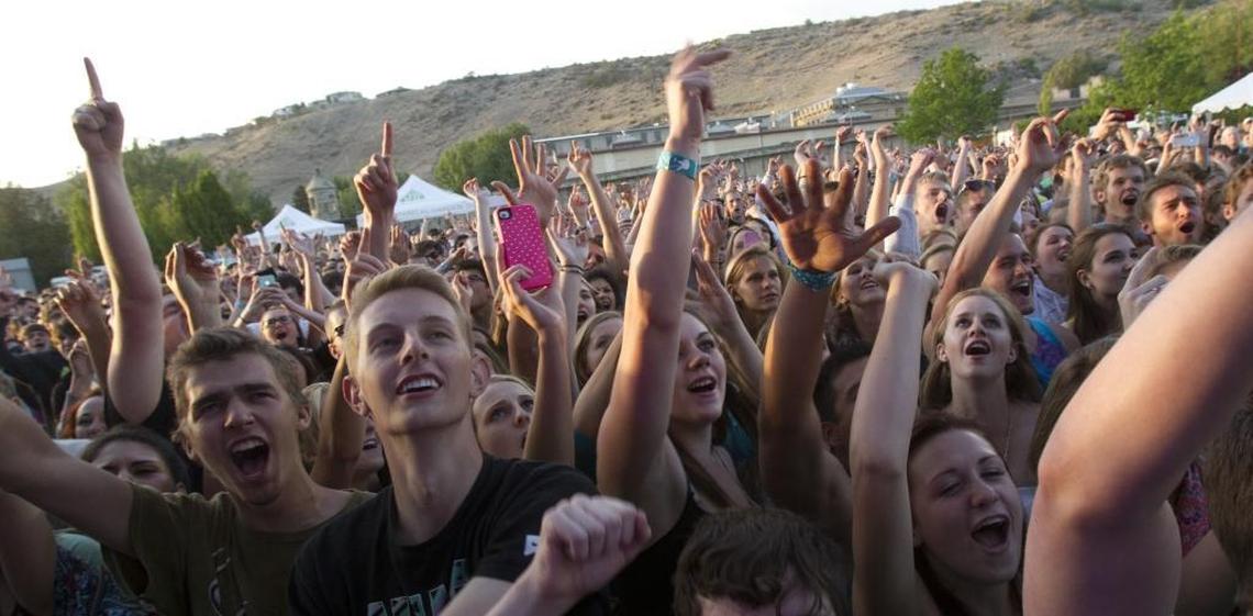 Front-row fans cheer at an Outlaw Field concert. The series was canceled this summer.