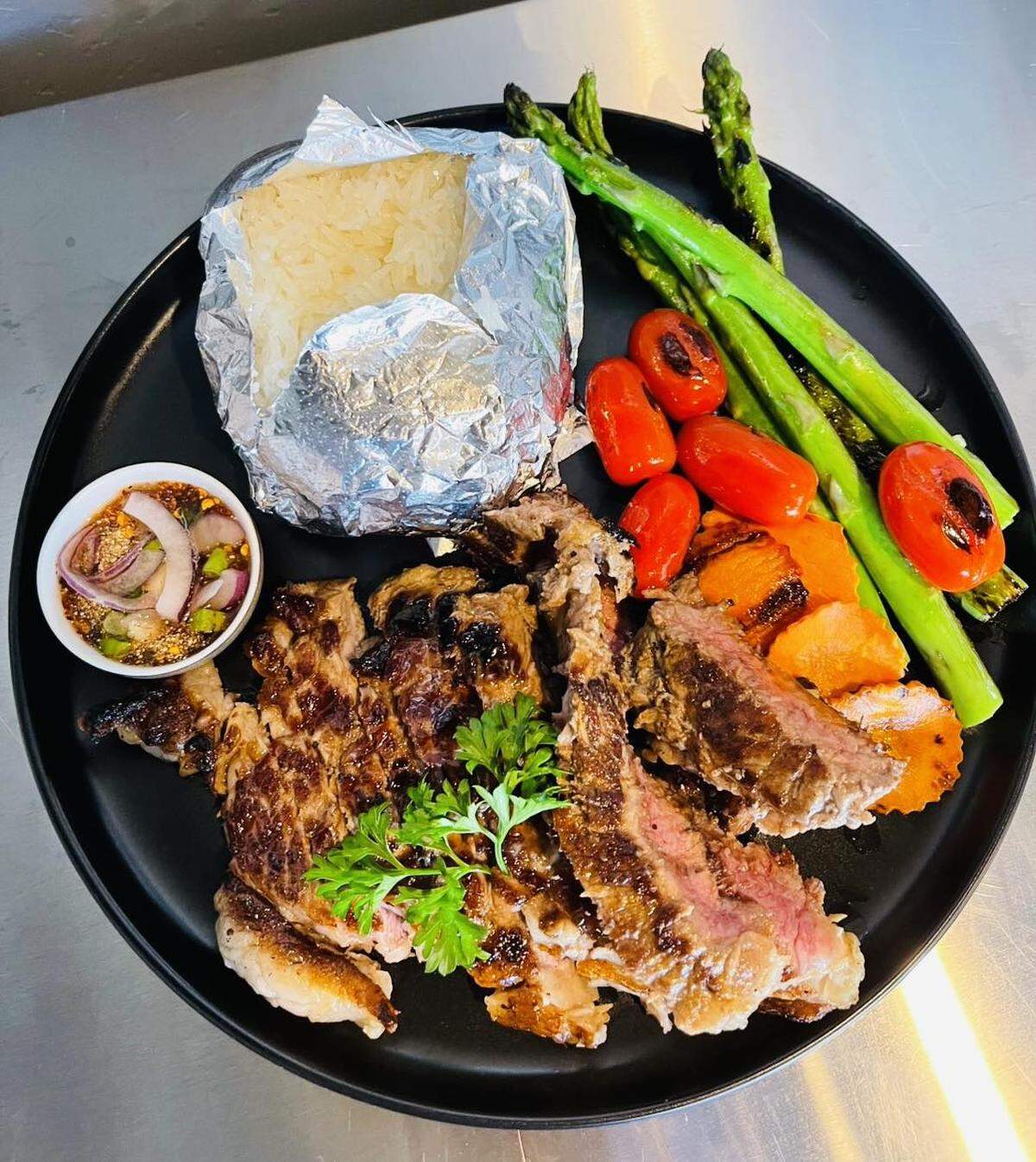 Crying Tiger, a marinated rib-eye steak, “will make you fall in love at first bite,” the restaurant says.