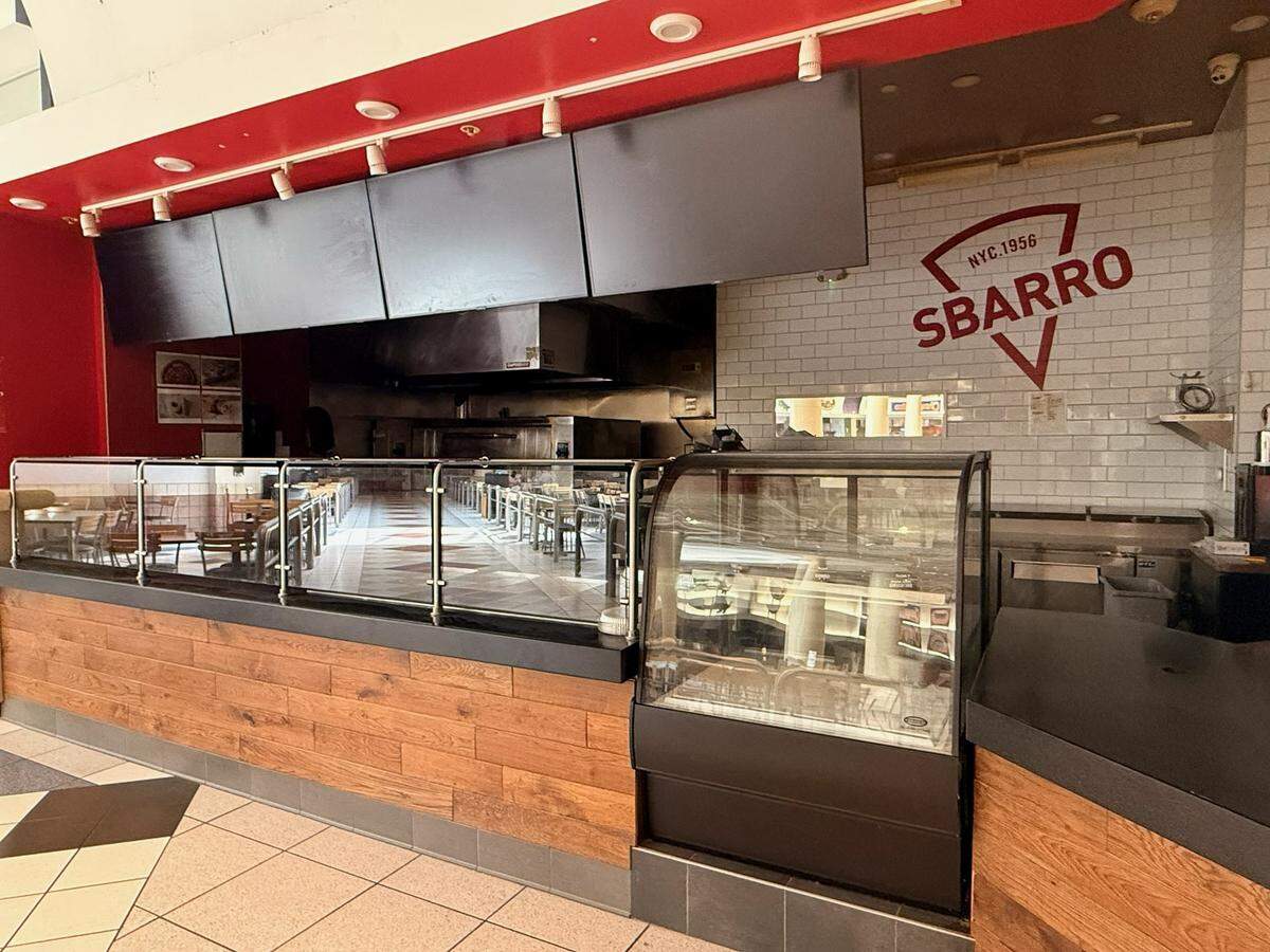 The kitchen is dark and the oven is off at Sbarro’s former space in the mall.