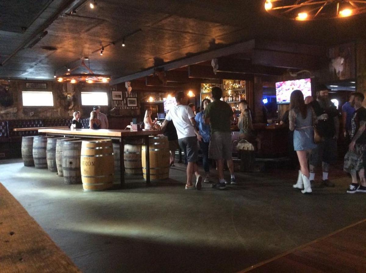 Bargoers enjoy a drink at a private reopening of the Ranch Club in 2017.