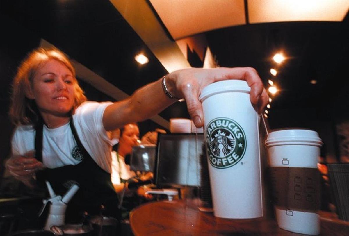 A barista delivers coffee after Starbucks opened at 1797 W. State St. in Boise in 2008.
