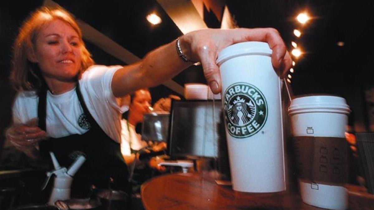 A barista delivers coffee after Starbucks opened at 1797 W. State St. in Boise in 2008.