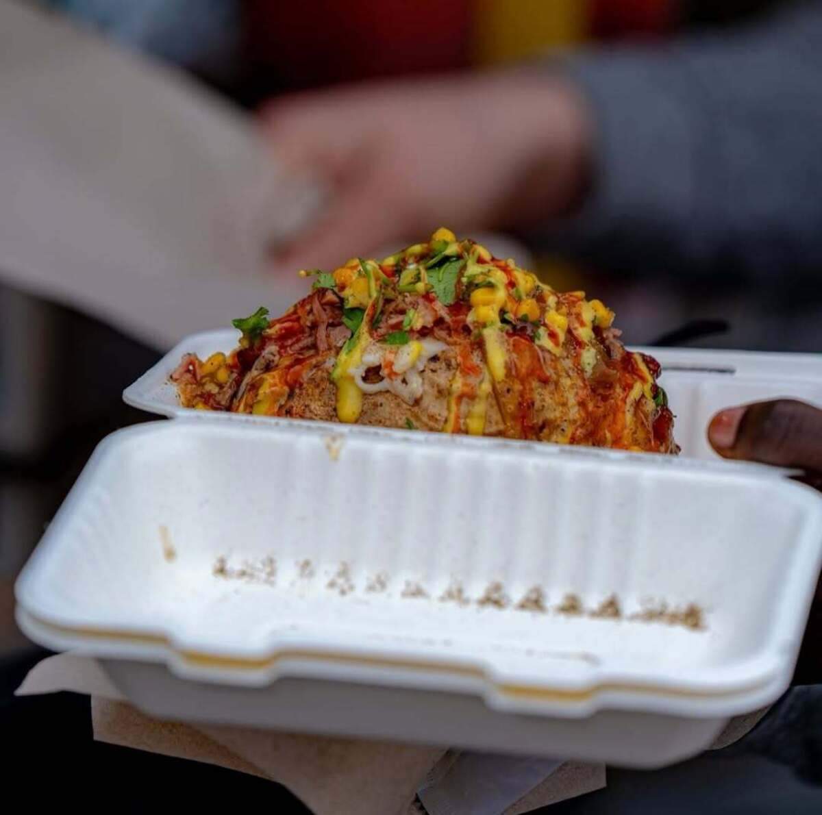 Spud Daddy served its loaded baked potatoes to football players prior to the Famous Idaho Potato Bowl in December. Pictured is a 40-count potato topped with smoked pit ham, creamy parmesan sauce, green onions, corn salsa and cilantro.