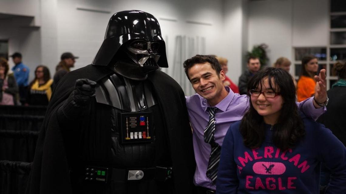 Fans pose with actor Daniel Logan, center (who played young Boba Fett in “Star Wars: Episode II – Attack of the Clones”), at the first “Star Wars Invades the Treasure Valley” event.