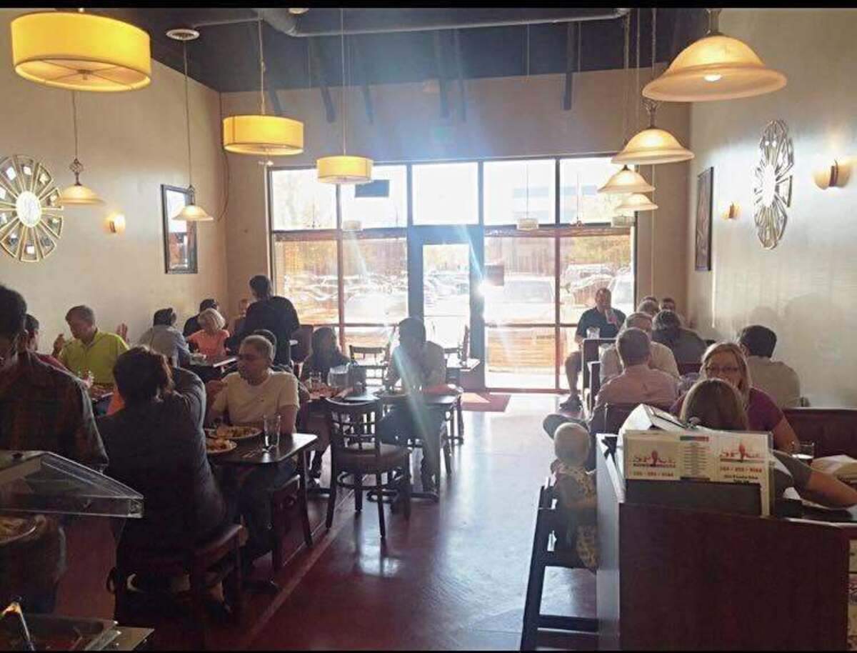 Customers enjoy food at Spice Indian Cuisine, which is located two doors down from Buffalo Wild Wings in Meridian.