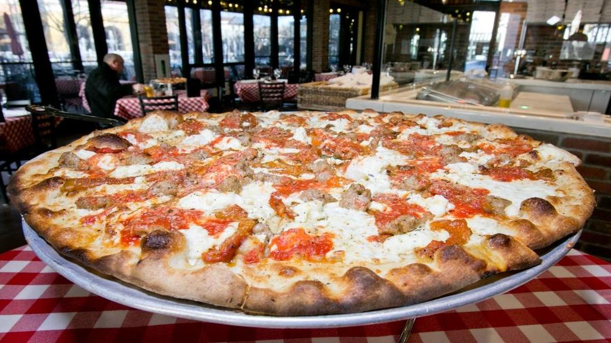 A Brooklyn Bridge pizza at Grimaldi's Pizzeria at The Village at Meridian. Customers can pick up a 16-inch traditional cheese pizza for $10 every Monday in October. Additional toppings cost extra. The offer is good for dine-in and to-go orders only.