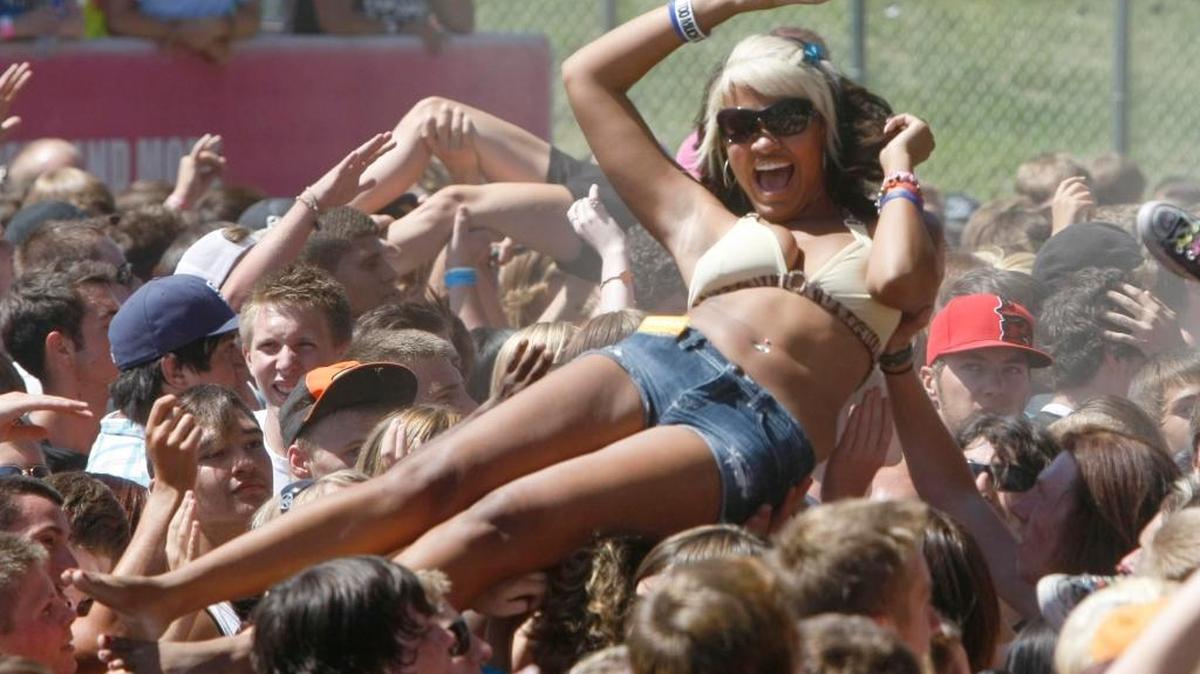 A fan rides a wave of fun at the 2011 Vans Warped Tour at the Idaho Center Outdoor Amphitheater in Nampa.