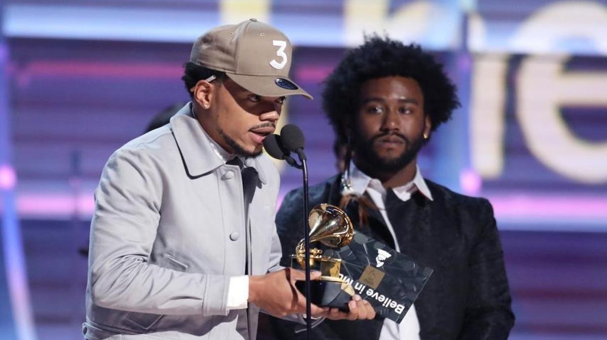 Chance The Rapper accepts the award for best rap album for “Coloring Book” at the 59th annual Grammy Awards on Sunday.
