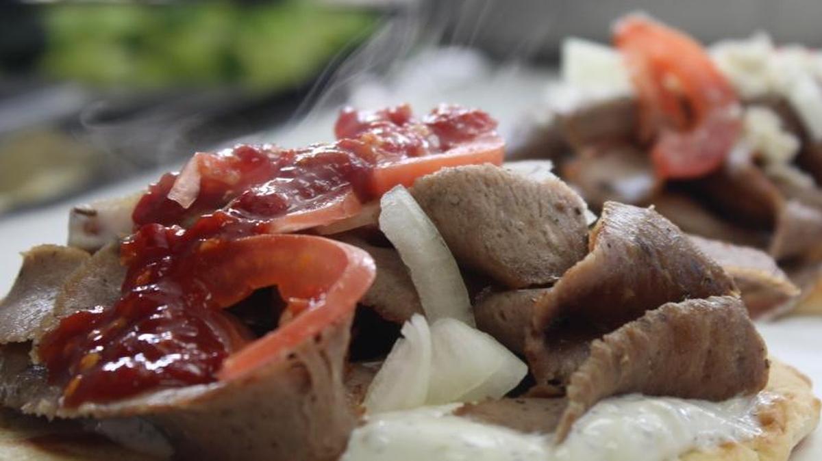 The Deluxe: Gyro meat, Tzatziki sauce, tomato and onion, topped with feta cheese.