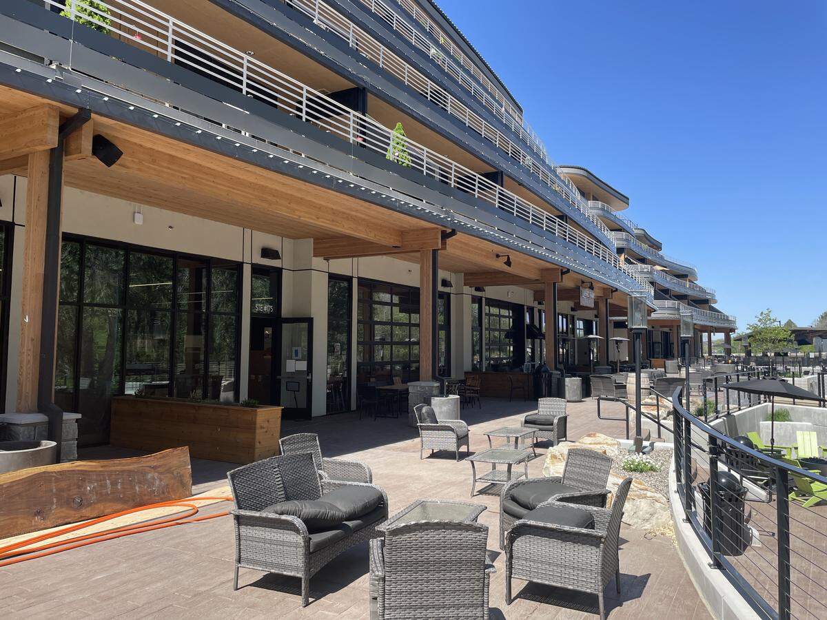 With garage doors that open to the plaza, Spitfire Tacos + Tequila and Ground Rules sports bar will open in spaces on the east end.