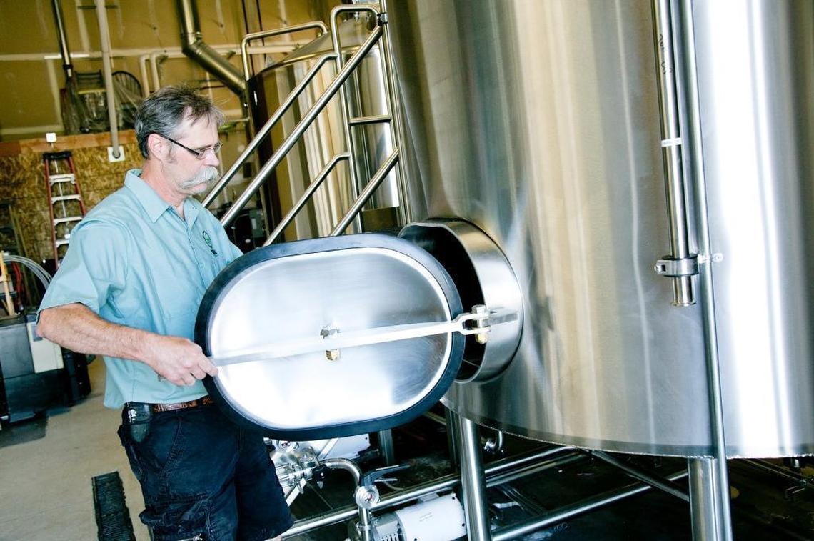 In this 2016 file photo, the Mad Swede himself, Jerry Larson, closes the door of a brewing tank.