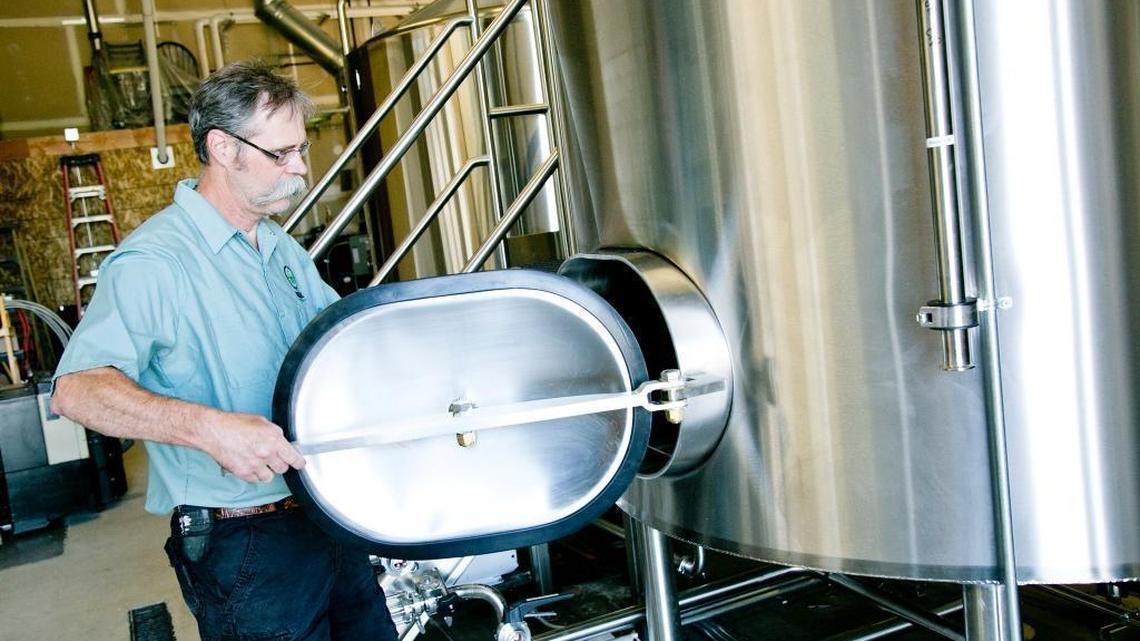 In this file photo from 2016, The Mad Swede himself, Jerry Larson, closes the door of a tank at the Cole Road brewery.