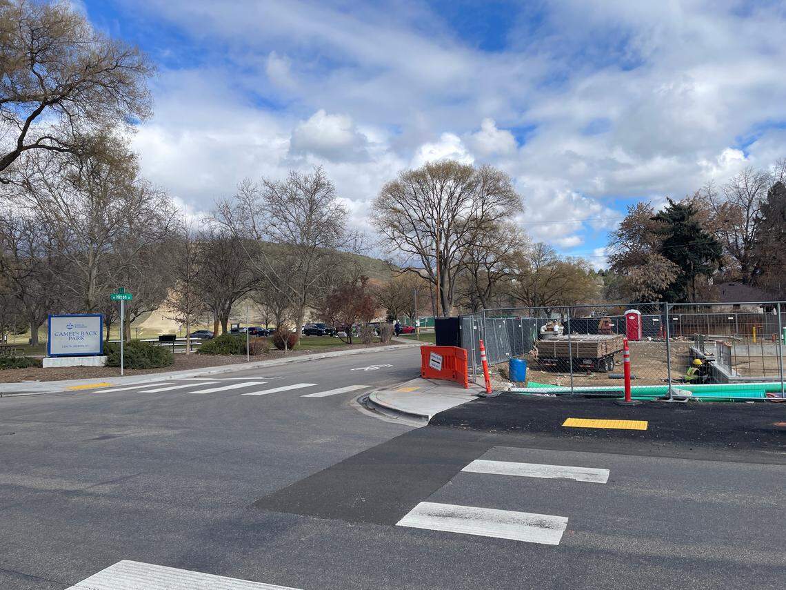 Workers crouch next to the foundation of a planned new building at 13th and Heron streets, where Wyld Child will open.