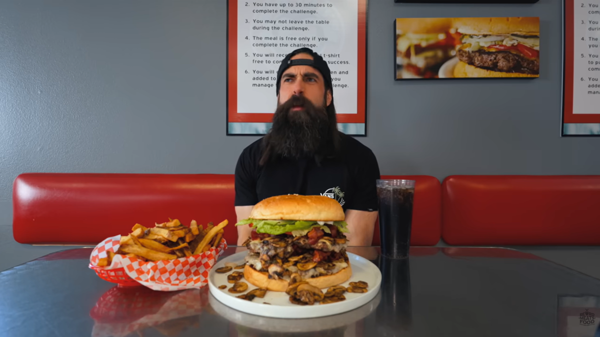 YouTube personality Adam Moran of “Beard Meats Food” prepares to take on a rather large meal at Big Jud’s.