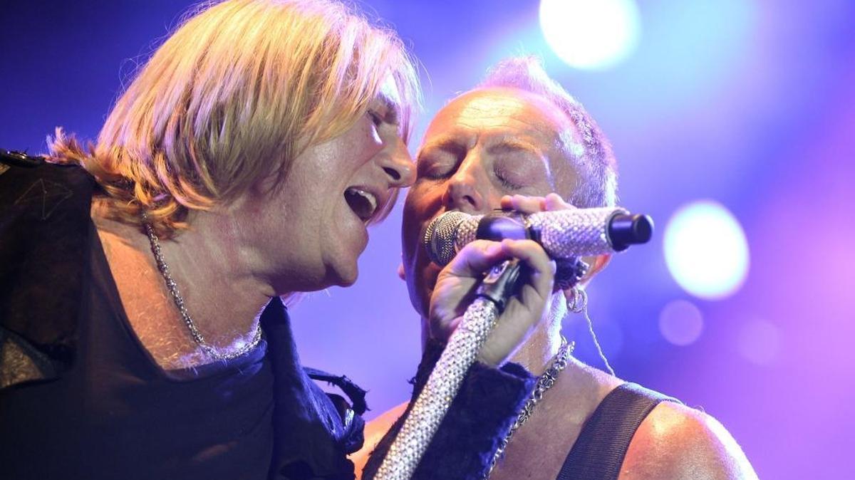 Joe Elliott, left, and Phil Collen perform with the band Def Leppard in 2012 in Los Angeles.