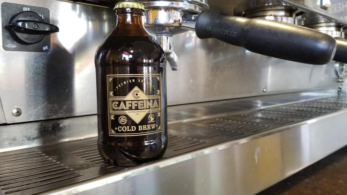 Along with traditional drinks served in house, Caffeina Coffee Roasting Co. will sell packaged products like this cold brew in a bottle.