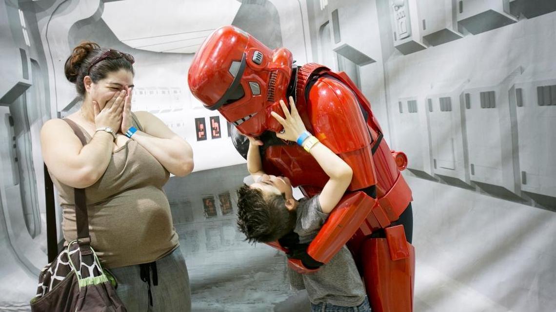 In this 2014 file photo from Tree City Comic Con in Boise, a boy hugs a “Star Wars” Magna Trooper as the child’s mother looks on. The sci-fi/fantasy convention at Expo Idaho did not return in 2015.