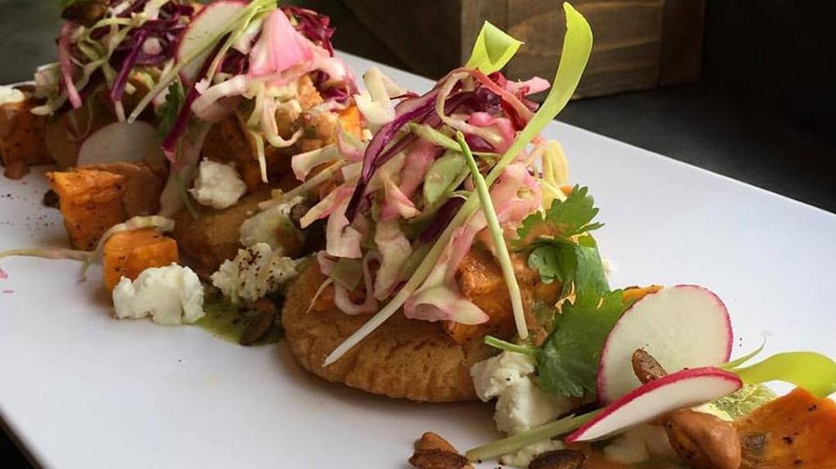Wild Root Cafe and Market, 276 N. 8th St., Boise, features vegetarian, vegan and other meat dishes on chef Michael Trebbi’s menu. Pictured is a hot-plate lunch special of roasted butternut squash, goat cheese, green chili salsa and crema roja.
