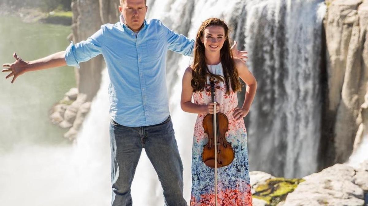 Pianist Trevor Loucks and violinist Crista Guthrie at the top of Shoshone Falls in July. This is the perch where Guthrie stood during the video.
