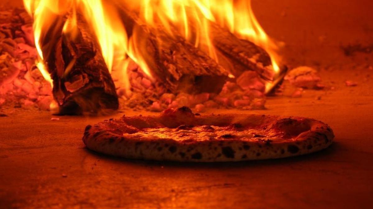A pie in the fire at Flatbread Neapolitan Pizzeria, which opens this week in Eagle.