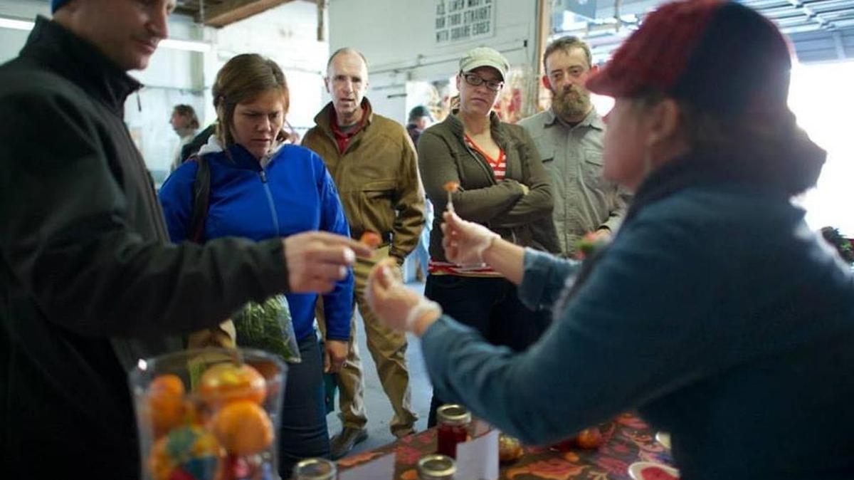 Josie Erskine from Peaceful Belly Farm works the crowd at the Boise Farmers Market.