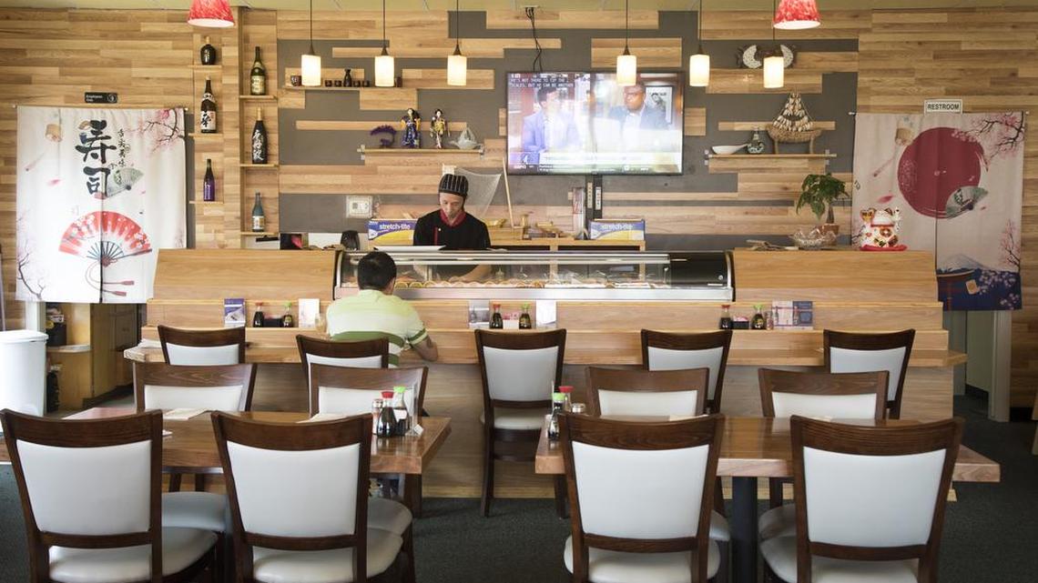 Sushi chef Weiming Yu presides over the sushi bar at Island Sushi and Ramen on Fairview Avenue.