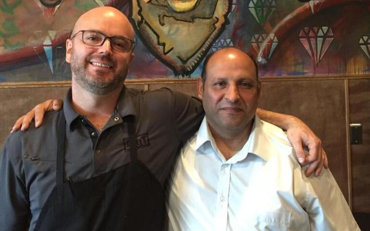 Grit chef Paul Faucher, left, with Hussein Jumaah.