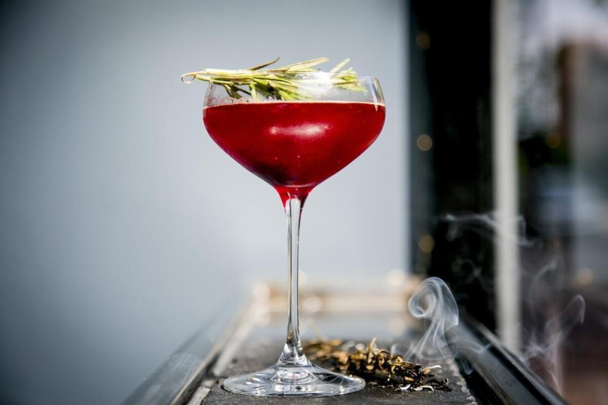 A Secret Garden cocktail made with Buffalo Trace bourbon, beet shrub, lemon, angostura, rosemary, and fresh cracked pepper at The Mode Lounge in Boise, Idaho. Tuesday June, 06, 2017.