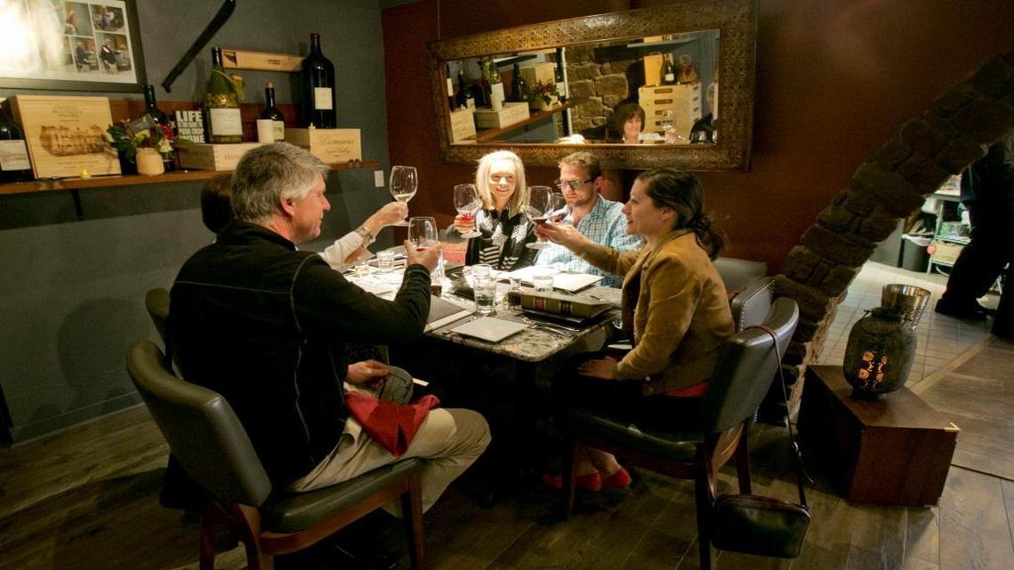 Diners raise a toast before dinner at Capitol Cellars.