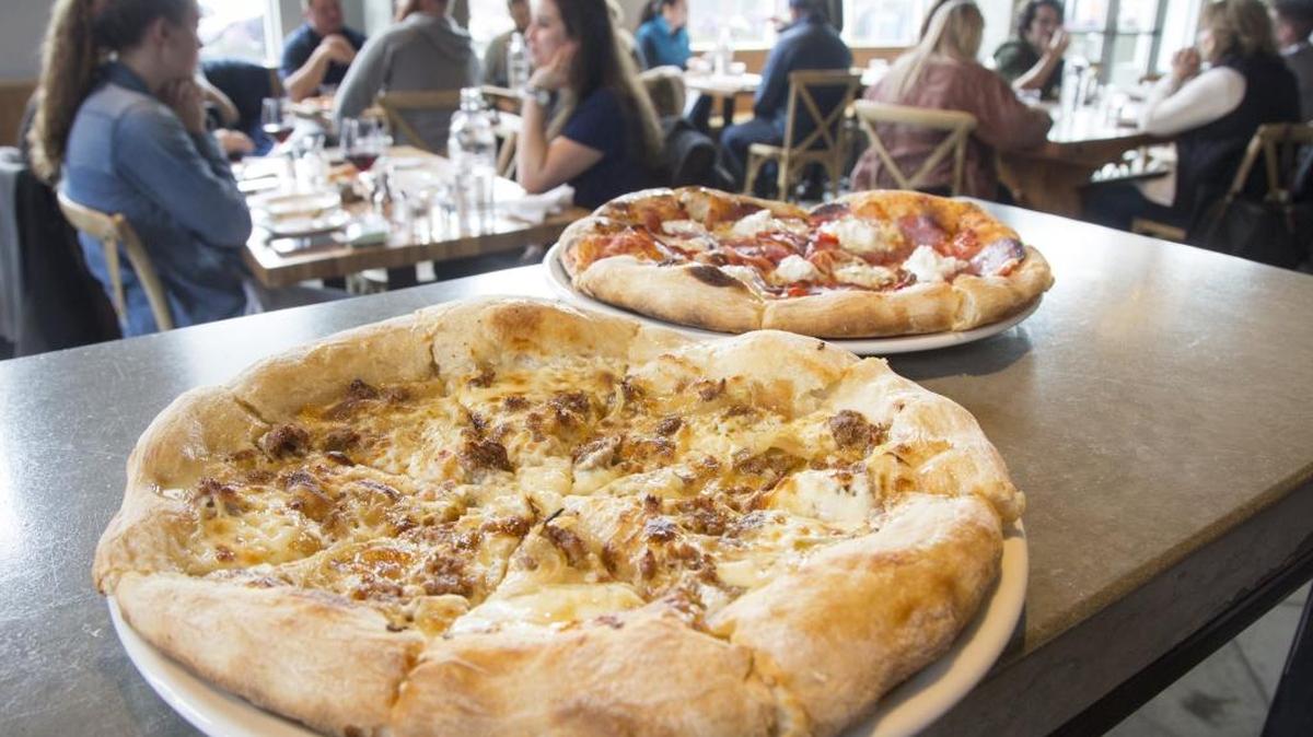 The Honey Badger white pizza with Italian sausage, ricotta, carmelized onion and spicy honey ($18); and the Bronco, featuring salumi, pickled fresno chilies, and burratta cheese ($18). The Wylder restaurant in the new Fowler Building in Downtown Boise.