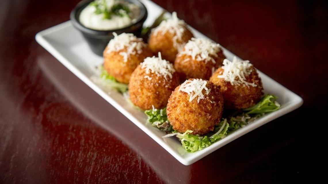 The risotto bites have a delightfully crunchy Parmesan crust and come with roasted garlic aioli.