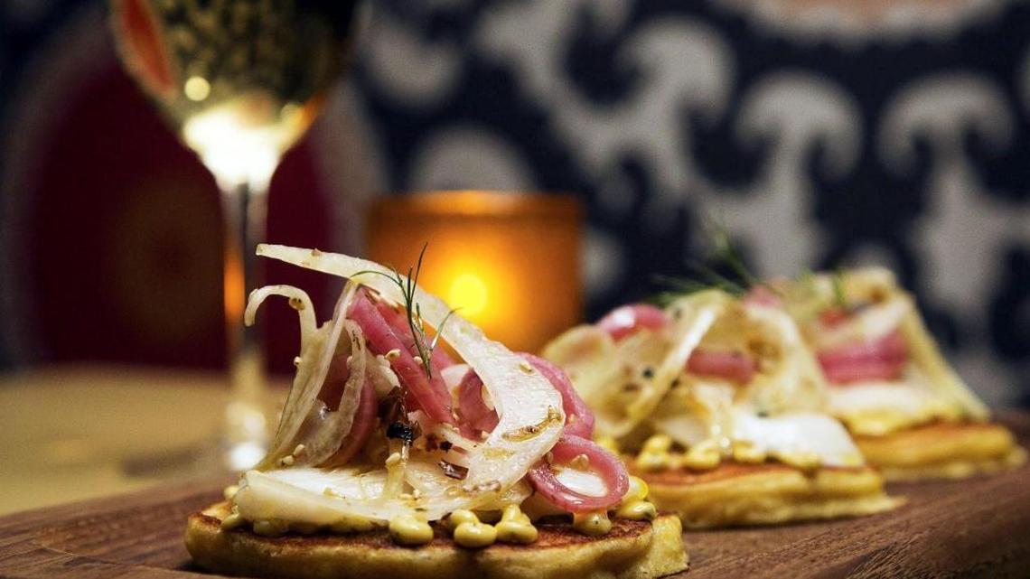 Camel’s Crossing offers a selection of small-plate offerings during happy hour (4-6 p.m. Monday through Friday), such as the corn pancake with seared rockfish, fennel, pickled onion salad and serrano pepper aioli.