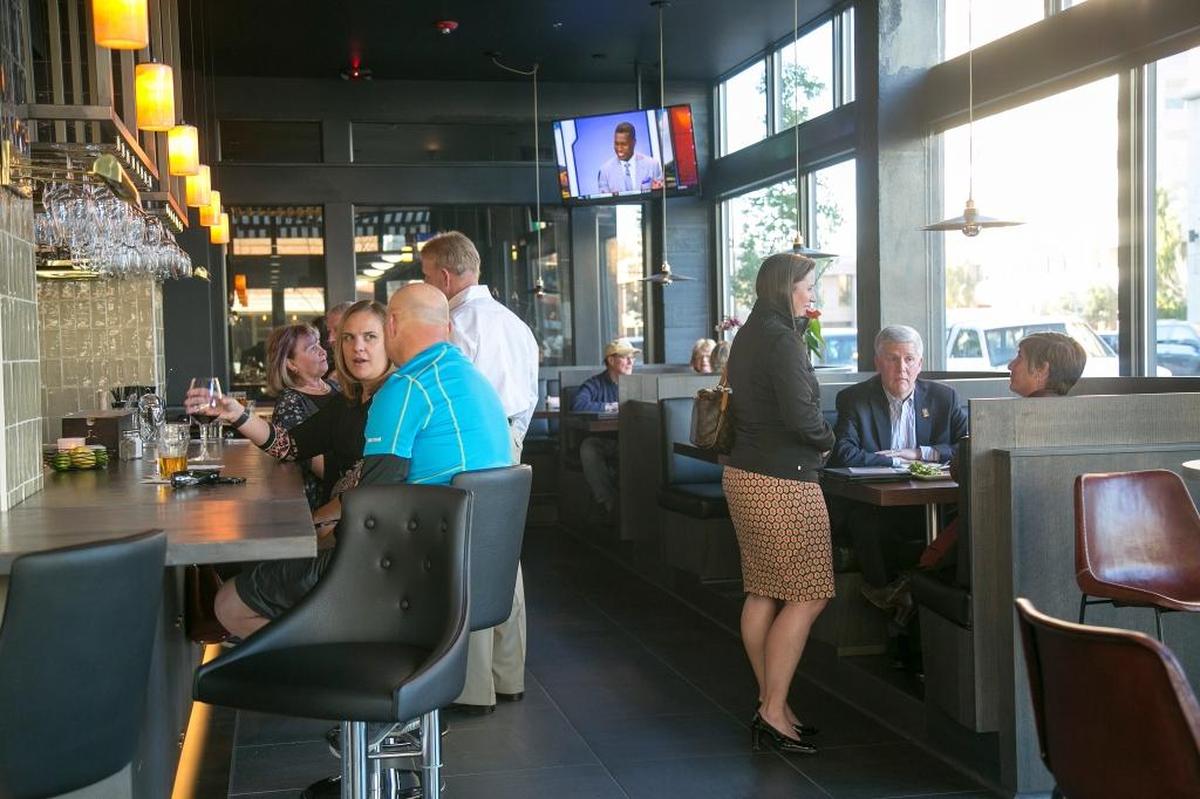 Patrons fill the bar area during happy hour at the Owyhee Tavern in Boise, which plans to add a brunch menu in March.