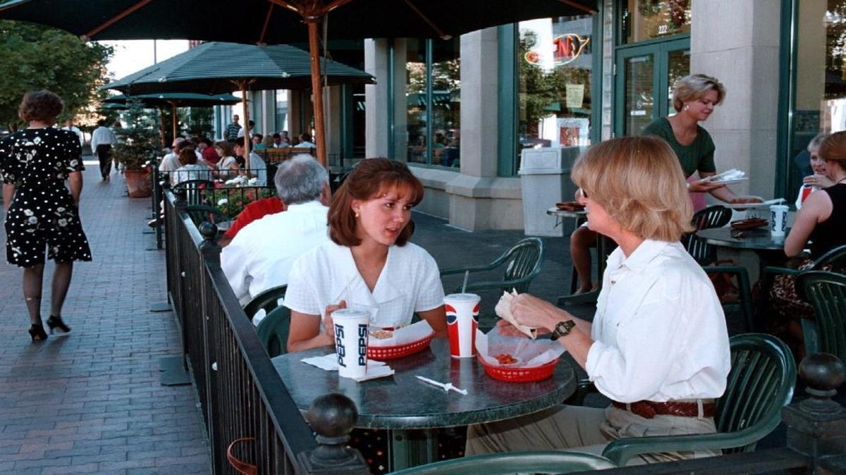 Diners outside Pollo Rey during the bustle of lunch hour on 8th Street.