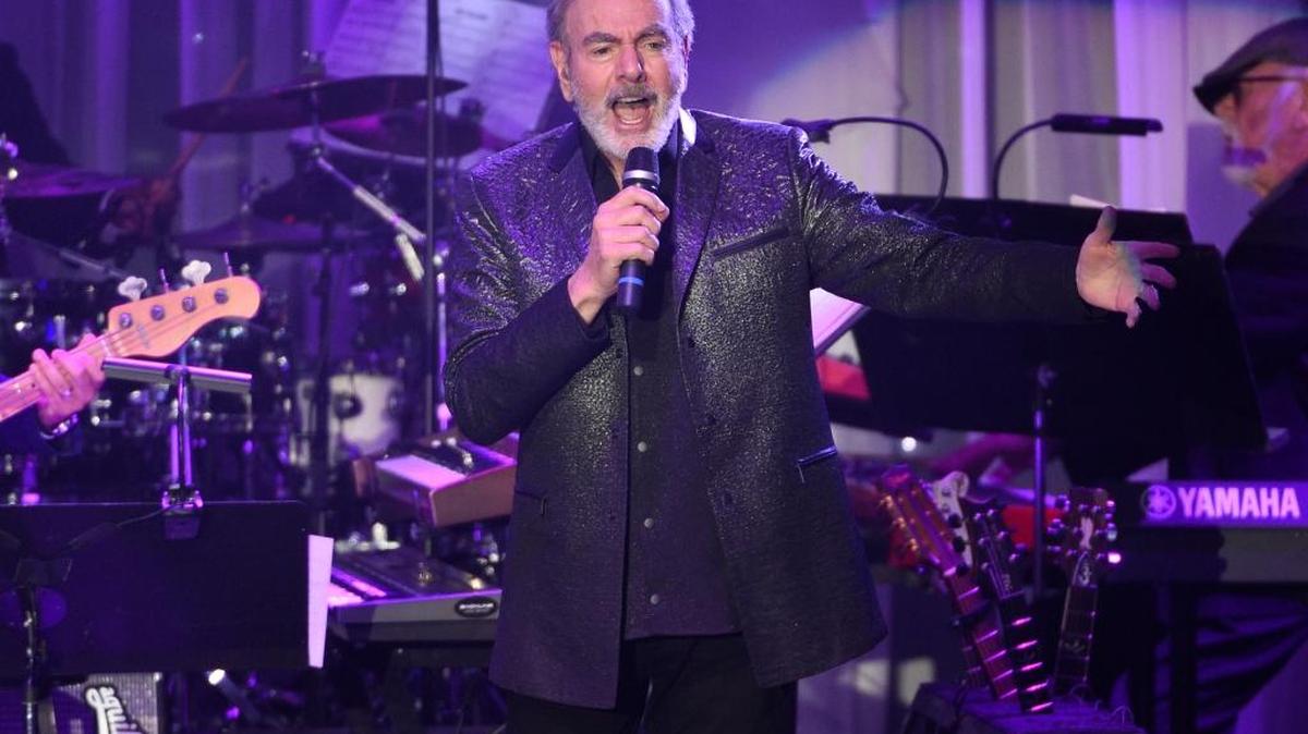 Music legend Neil Diamond, shown here performing at the Clive Davis and The Recording Academy Pre-Grammy Gala in 2017, is retiring from touring. The 77-year-old says he was diagnosed with Parkinson’s disease.
