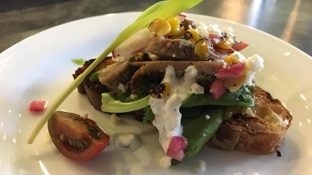Enjoy a mini bruschetta bite from Wild Root Cafe, one of the stops on Indulge Boise’s Historic Downtown Boise Food & Cultural Tour.