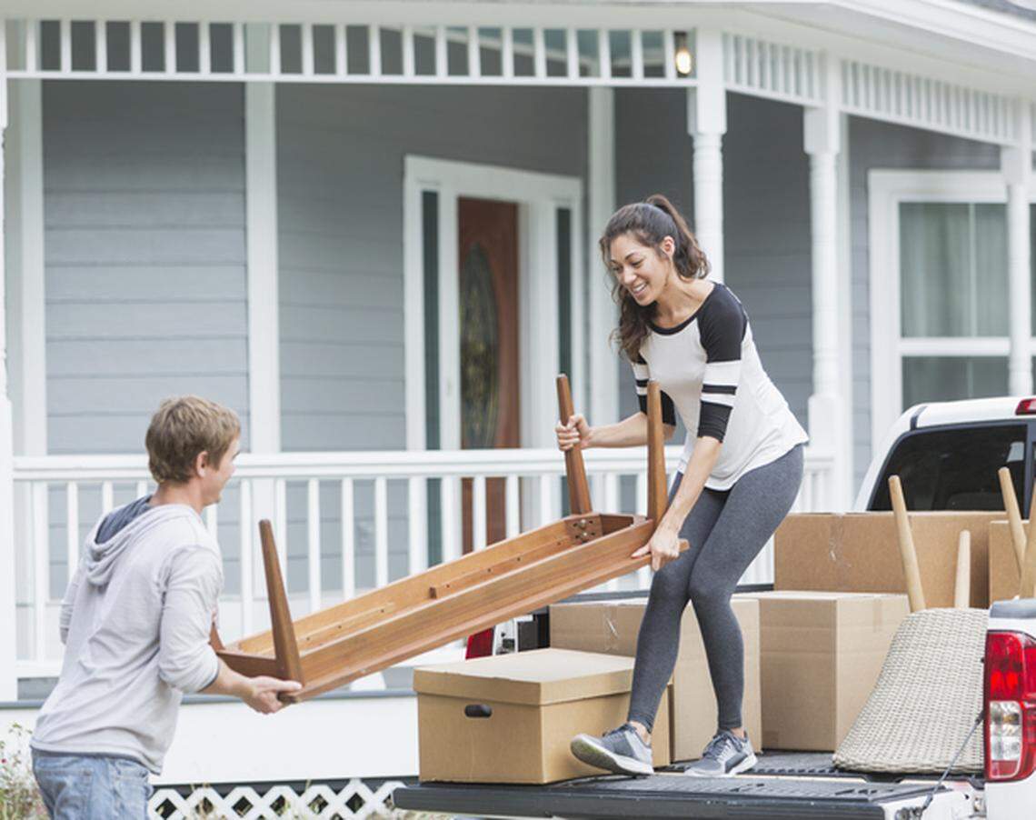 A young couple moving into their first home.