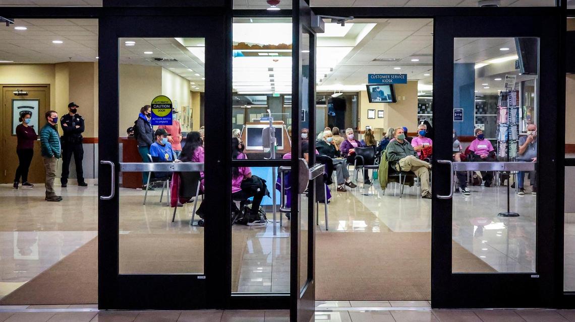 Concerned citizens watch a Boise City Hall lobby monitor during the Planning and Zoning Committee meeting.