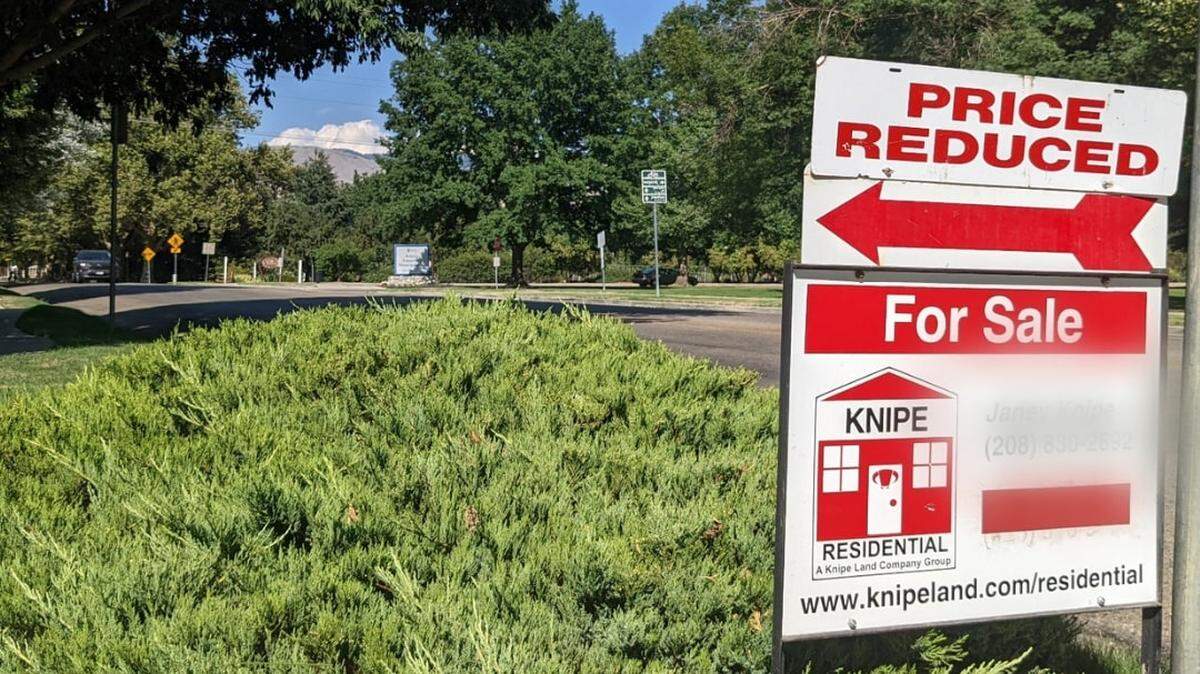 A price-reduced sign on a home for sale in Boise. The housing market slowed between 2022 and the beginning of 2023, resulting in a decrease in assessed values.