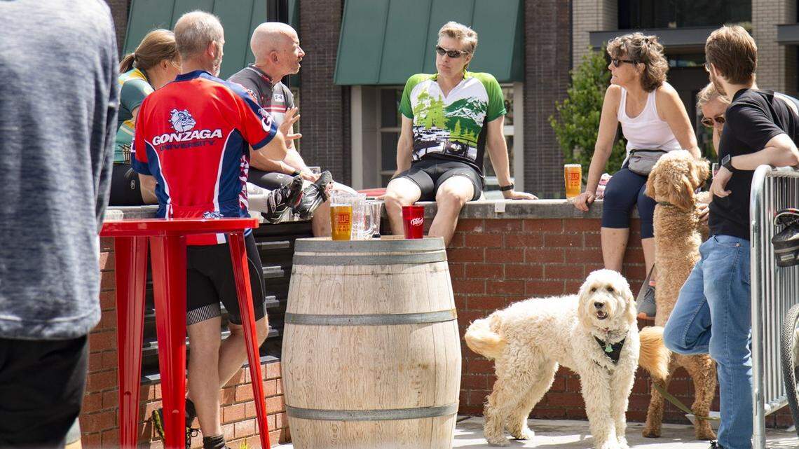 Customers enjoy sunshine on the patio at Brick West Brewing last year in Spokane.