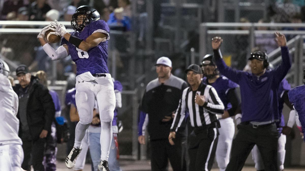 Rocky Mountain linebacker Joe Strickland intercepts a Skyview pass in first half Friday as the Grizzlies clinched the 5A SIC title with a 42-23 win over the Hawks.