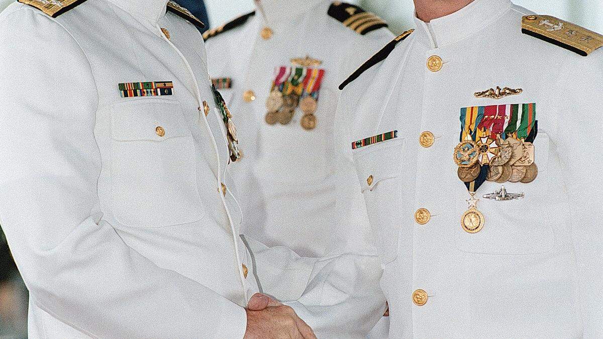 U.S. Navy Adm. Archie R. Clemins, Commander In Chief, U.S. Pacific Fleet, left, congratulates Rear Adm. Winford G. ‘Jerry’ Ellis, USN, after awarding him the distinguished service medal for his accomplishments as Commander Submarine Force Pacific. Pearl Harbor, Hawaii, 8 May 1998.