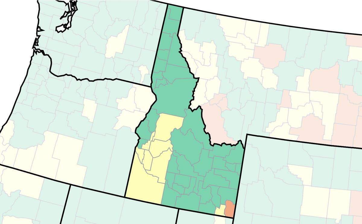 The U.S. Centers for Disease Control and Prevention’s COVID-19 community-level map by county, captured Friday. Green means low risk, yellow medium risk and red high risk.